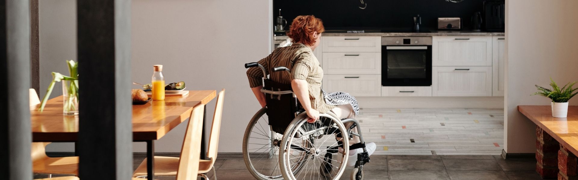 woman in wheelchair in kitchen